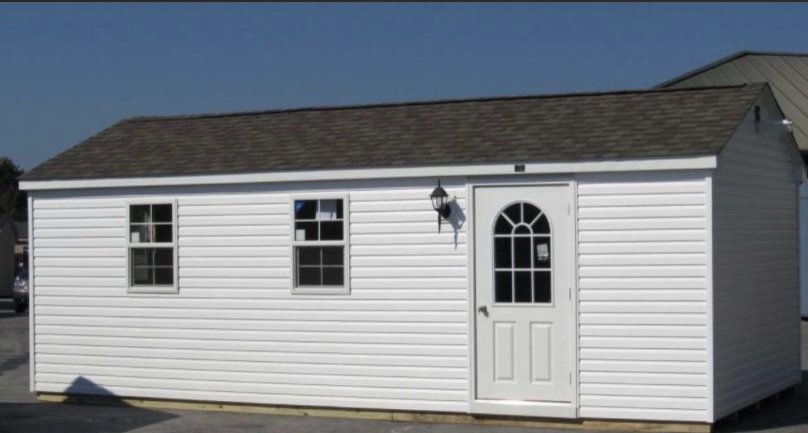 White vinyl shed with arched door
